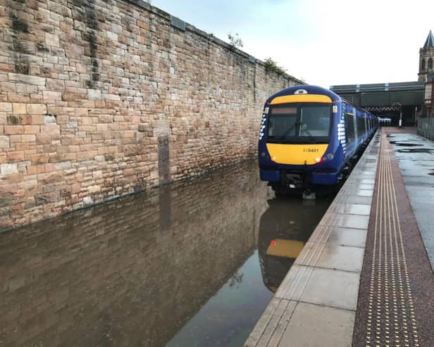 British Transport Police, which patrols Scotland’s rail network, shared a photo of a completely flooded track at Perth Station, urging passengers to be wary of delays after “significant disruption”.