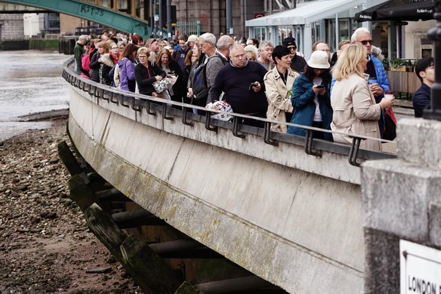 Members of the public in the queue on the South Bank, central London, as they wait to view Queen Elizabeth II lying in state ahead of her funeral on Monday. Picture date: Thursday September 15, 2022.