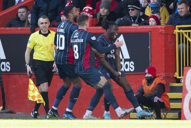 Ross County's Joseph Hungbo celebrates firing County into the top six.