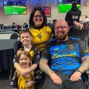 Mark Williams with his wife Stephanie and their two children. Photo: My Name'5 Doddie Foundation/PA Wire