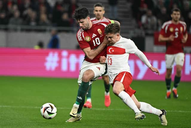 Rangers' Ridvan Yilmaz (right) in action for Turkey against Hungary on Friday prior to picking up an injury. (Photo by ATTILA KISBENEDEK/AFP via Getty Images)
