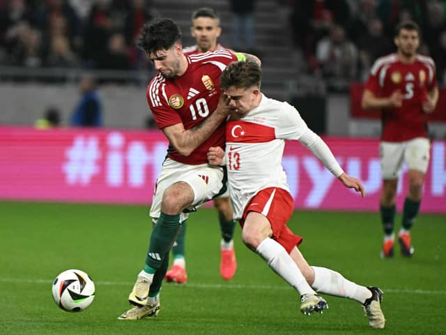 Rangers' Ridvan Yilmaz (right) in action for Turkey against Hungary on Friday prior to picking up an injury. (Photo by ATTILA KISBENEDEK/AFP via Getty Images)