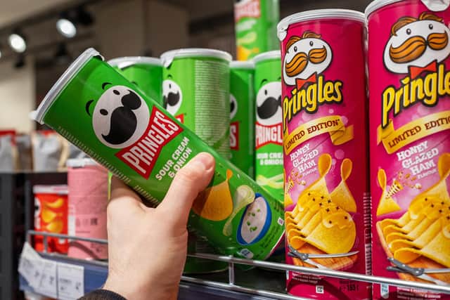 Tesco’s magazine features ‘healthy’ recipes – but processed foods like Pringles feature prominently in the advertising (Picture: 8th - stock.adobe.com)