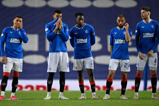 Rangers players look on disconsolately during the penalty shoot-out defeat against St Johnstone in the Scottish Cup quarter-final. (Photo by Rob Casey / SNS Group)