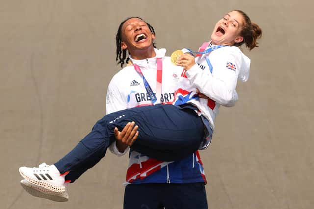 Kye Whyte and Bethany Shriever celebrate at the medal ceremony