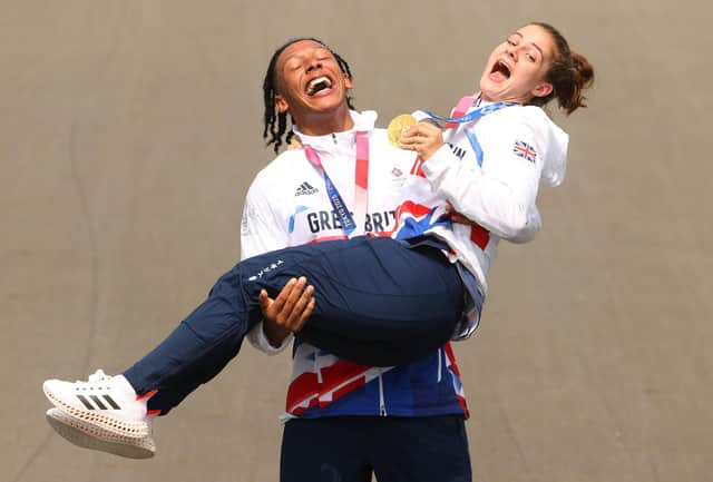 Kye Whyte and Bethany Shriever celebrate at the medal ceremony