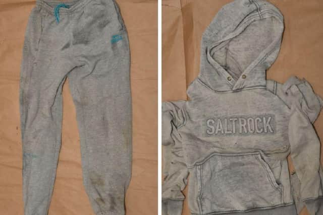 The man was wearing grey Lonsdale jogging trousers and a grey hooded Saltrock jumper.