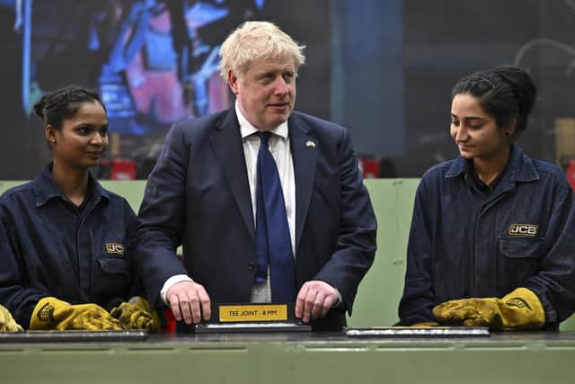 Prime Minister Boris Johnson speaks to workers at the new JCB Factory in Vadodara, Gujarat, during his two day trip to India.