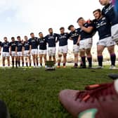 Scotland players celebrate with the trophy after defeating Argentina at the end of their international rugby union match at Padre Ernesto Martearena Stadium in Salta, Argentina on July 9, 2022.