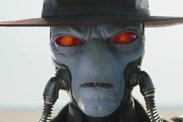 Cad Bane returns, revealing his unmistakable face underneath the brim of his cowboy hat. Photo: Disney.