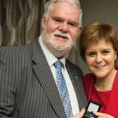 Stuart Pratt with First Minister Nicola Sturgeon at an event in 2017 to mark his service as a local councillor.