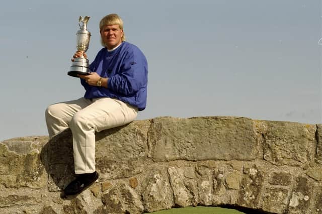 John Daly holds the Claret Jug after winning The Open at St Andrews in 1995.