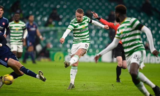 Leigh Griffiths scores to the opener at Celtic Park. (Photo by Rob Casey / SNS Group)