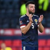 A downcast Grant Hanley applauds the fans after Scotland's 3-1 defeat by Ukraine in the World Cup play-off semi-final at Hampden. (Photo by Ross MacDonald / SNS Group)