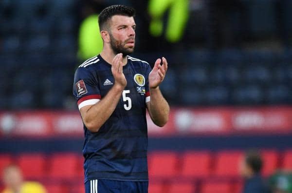 A downcast Grant Hanley applauds the fans after Scotland's 3-1 defeat by Ukraine in the World Cup play-off semi-final at Hampden. (Photo by Ross MacDonald / SNS Group)