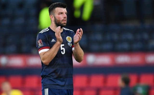 A downcast Grant Hanley applauds the fans after Scotland's 3-1 defeat by Ukraine in the World Cup play-off semi-final at Hampden. (Photo by Ross MacDonald / SNS Group)