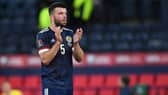 A downcast Grant Hanley applauds the fans after Scotland's 3-1 defeat by Ukraine in the World Cup play-off semi-final at Hampden. (Photo by Ross MacDonald / SNS Group)