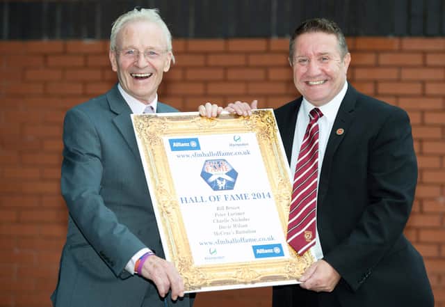 Davie Wilson (left) and alongside Hearts legend John Robertson after being inducted into the Scottish Football Hall of Fame in 2014. Picture: SNS