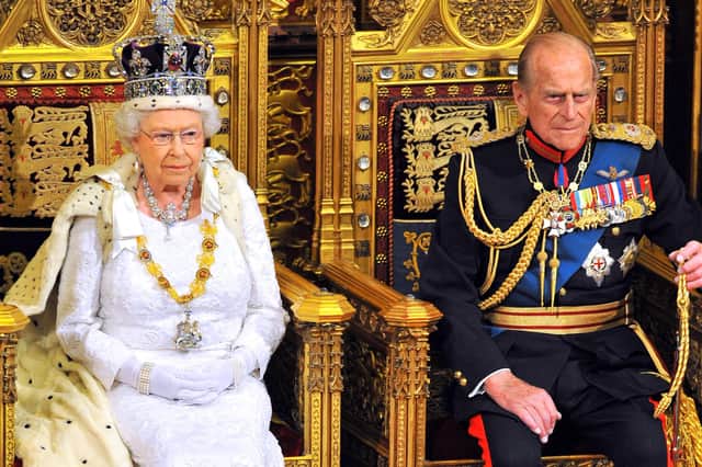 Queen Elizabeth sits with Prince Philip, Duke of Edinburgh as she delivers her speech during the State Opening of Parliament in 2004