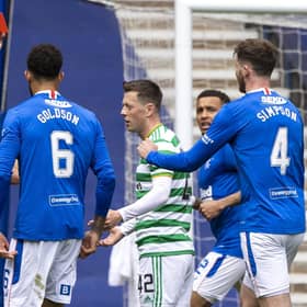Referee Nick Walsh shows Callum McGregor a red card during a Scottish Premiership match between Rangers and Celtic at Ibrox Park, on May 02, 2021.
