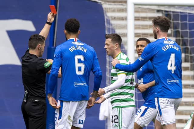 Referee Nick Walsh shows Callum McGregor a red card during a Scottish Premiership match between Rangers and Celtic at Ibrox Park, on May 02, 2021.