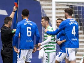 Referee Nick Walsh shows Callum McGregor a red card during a Scottish Premiership match between Rangers and Celtic at Ibrox Park, on May 02, 2021.