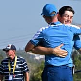 Europe's Norwegian golfer, Viktor Hovland (R) embraces Europe's English captain, Luke Donald on the 15th green after winning his foursomes match on the first day of play in the 44th Ryder Cup at the Marco Simone Golf and Country Club in Rome on September 29, 2023. (Photo by Andreas SOLARO / AFP) (Photo by ANDREAS SOLARO/AFP via Getty Images)