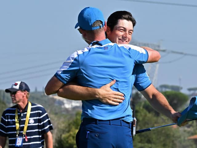 Europe's Norwegian golfer, Viktor Hovland (R) embraces Europe's English captain, Luke Donald on the 15th green after winning his foursomes match on the first day of play in the 44th Ryder Cup at the Marco Simone Golf and Country Club in Rome on September 29, 2023. (Photo by Andreas SOLARO / AFP) (Photo by ANDREAS SOLARO/AFP via Getty Images)