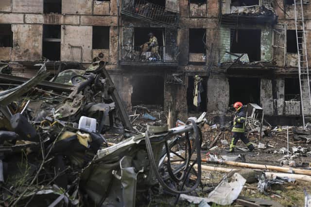 Emergency workers inspect a damaged multi-storey apartment building caused by the latest rocket Russian attack in Kryvyi Rih in Ukraine. Picture: AP Photo/Andriy Dubchak