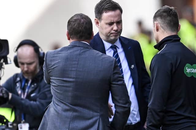 Celtic manager Brendan Rodgers shakes hands with Michael Beale after his team's 1-0 defeat of Rangers last month that the Irishman referenced in the "difficult" period that resulted in the 43-year-old losing his job. An outcome Rodgers acknowledges will be hard for his rival now, but whom he offered hope in suggesting "after the clouds comes the sunshine". (Photo by Rob Casey / SNS Group)
