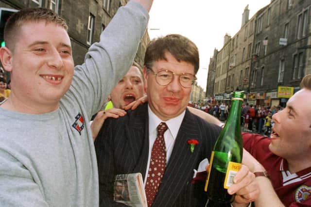 Eric Milligan shares his delight and that of the fans with Buckfast, while they await the return of the team from Celtic Park with the Scottish Cup Pic Tony Marsh