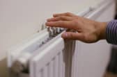 A hand on a radiator.
