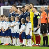 Scotland sing their national anthem during the 150th Anniversary Heritage Match between Scotland and England at Hampden Park, on September 12, 2023, in Glasgow, Scotland.