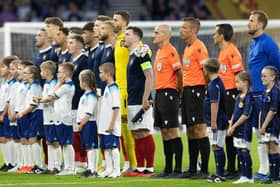 Scotland sing their national anthem during the 150th Anniversary Heritage Match between Scotland and England at Hampden Park, on September 12, 2023, in Glasgow, Scotland.