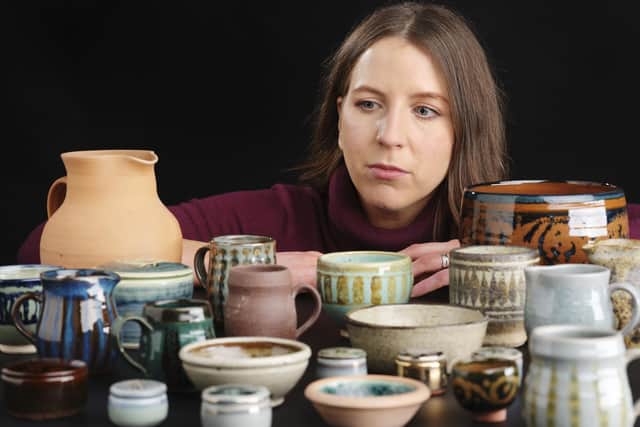 Dr Ailsa Hutton, assistant curator, modern and contemporary history at the National Museums Scotland with a collection of pottery by Joan Faithfull, which has been donated to the nation by her sons. Picture: NMS/PA Wire