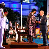 TOPSHOT - Charles, Prince of Wales (R) receives the Order of Freedom of Barbados from President of Barbados Dame Sandra Mason (2nd R) during the ceremony to declare Barbados a Republic and the Inauguration of the President of Barbados at Heroes Square in Bridgetown, Barbados, on November 30, 2021. - Fireworks filled the sky over Barbados as the Caribbean island nation declared itself the world's newest republic, lowering Queen Elizabeth's flag as it severed colonial-era ties to the British throne to the sound of jubilant gun salutes. (Photo by Randy Brooks / AFP) (Photo by RANDY BROOKS/AFP via Getty Images)