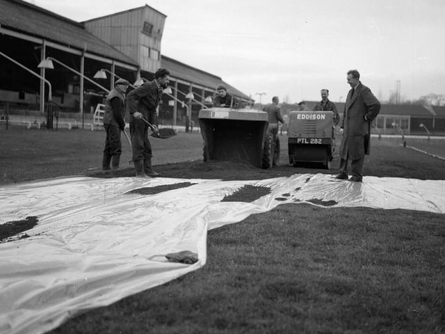 Staff at Powderhall prepare a surface of red blaes for the traditional New Year Sprint in 1964.