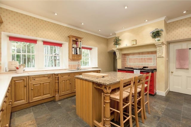 Kitchen with four door AGA and central island.