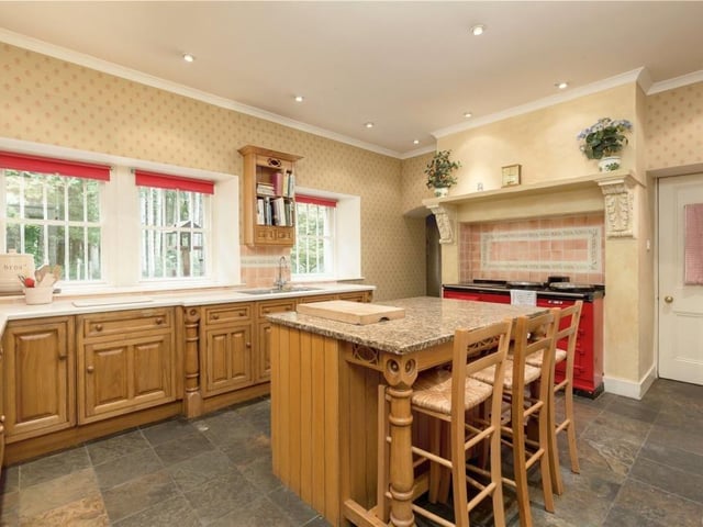 Kitchen with four door AGA and central island.