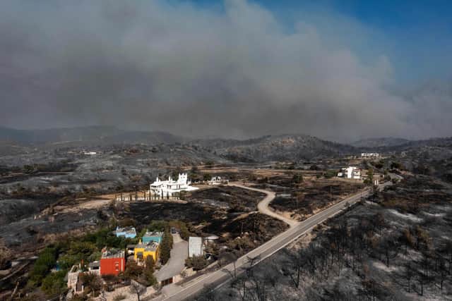 An aerial view shows smoke billowing in background of Kiotari village, on the island of Rhodes.