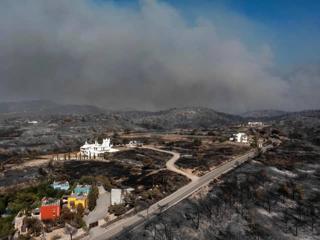 An aerial view shows smoke billowing in background of Kiotari village, on the island of Rhodes.
