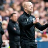Steven Naismith gives the thumbs-up to Hearts after overseeing the 6-1 win over Ross County.