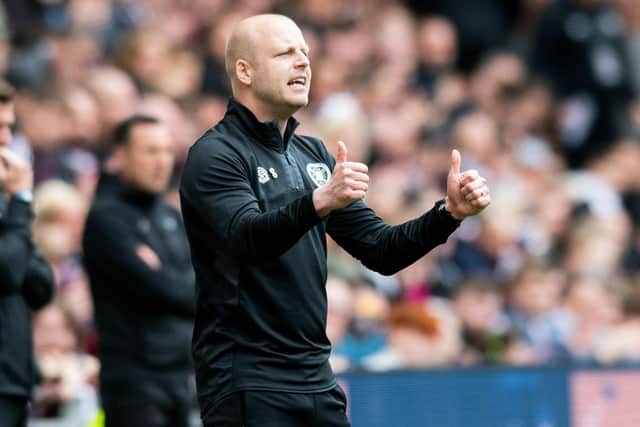 Steven Naismith gives the thumbs-up to Hearts after overseeing the 6-1 win over Ross County.