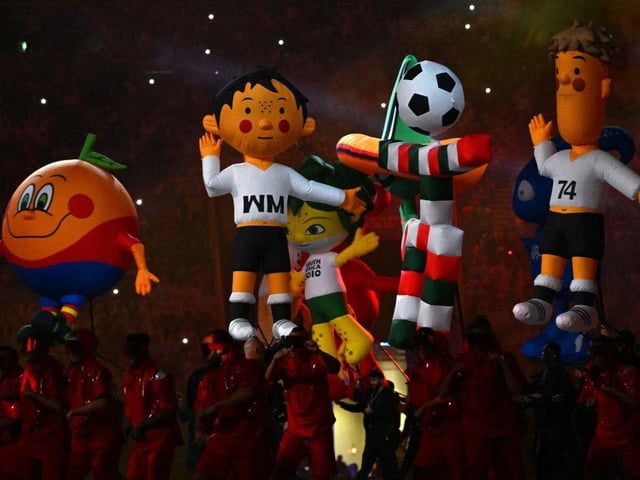Former World Cup mascots join in the fun at the opening ceremony.