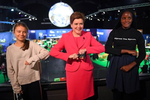 Nicola Sturgeon had her picture taken with climate activists Greta Thunberg (left) and Vanessa Nakate at COP26 last year (Picture: Andy Buchanan/Pool/Getty Images)