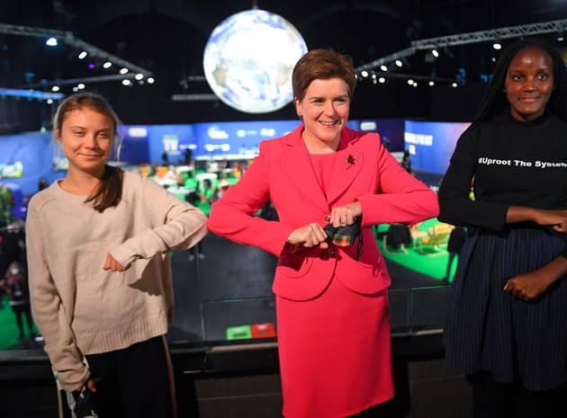 Nicola Sturgeon had her picture taken with climate activists Greta Thunberg (left) and Vanessa Nakate at COP26 last year (Picture: Andy Buchanan/Pool/Getty Images)