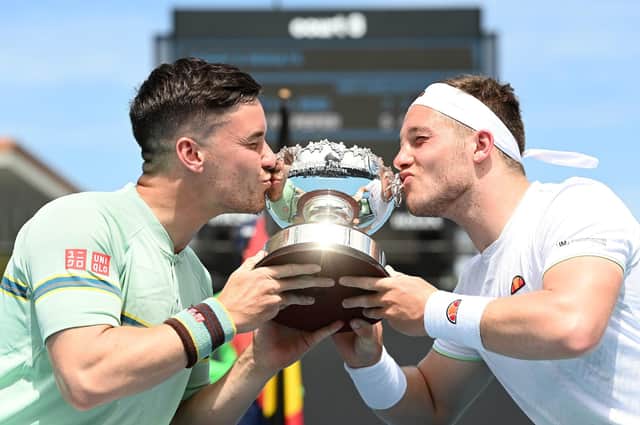 Scotland's Gordon Reid and England's Alfie Hewett kiss the championship trophy after the British pair won the men's wheelchair doubles final at the Australian Open at Melbourne Park. Picture: Quinn Rooney/Getty Images