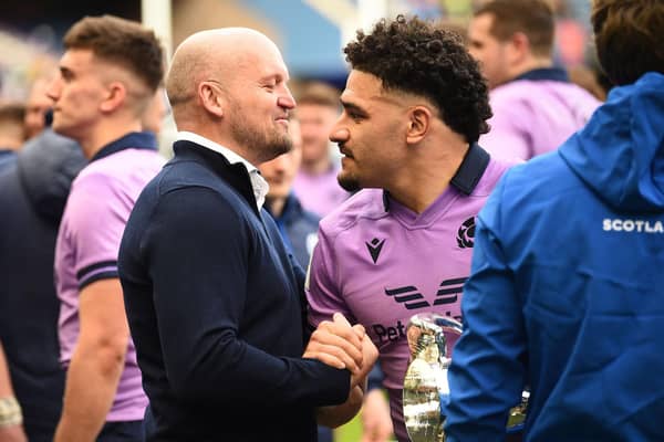 Scotland head coach Gregor Townsend (L) shakes the hand of Scotland's centre Sione Tuipulotu after the Six Nations international rugby union match between Scotland and Italy at Murrayfield Stadium.