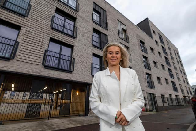 Amy O'Neil outside her new Lowther home at Calton Village