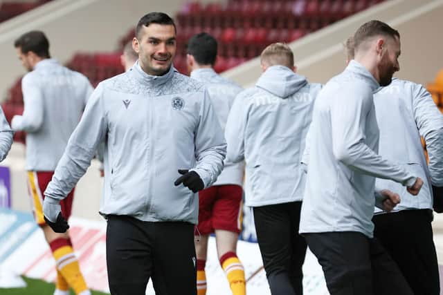 Motherwell's Tony Watt, pictured centre, warms up before the Boxing Day encounter with Livingston that became the first game in which manager Graham Alexander did the select the striker as a result of news breaking beforehand that he had singed a pre-contract agreement with Dundee United broke. (Photo by Alan Harvey / SNS Group)